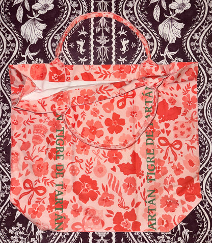 Jumbo slouchy denim tote in the Ditsy Christmas MARASCHINO print with Tigre de Tartán logo lettering, laid flat