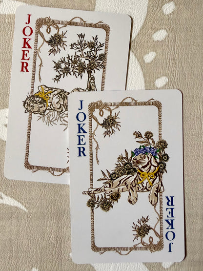 Two joker cards from the Jardín de Los Jefes deck, each with an illustrated tiger among botanicals