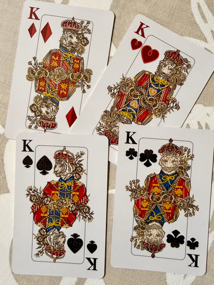 Four custom king court cards from the Jardín de Los Jefes playing cards, with big cat and botanical illustration