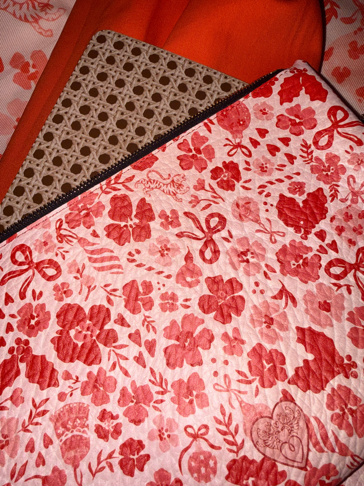 Close-up of the MARASCHINO medium pouch print with its embossed heart logo
