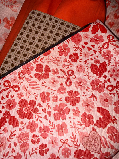 Close-up of the MARASCHINO medium pouch print with its embossed heart logo