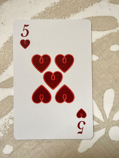 Five of hearts from the Jardín de Los Jefes deck with faux-stitched red heart pips