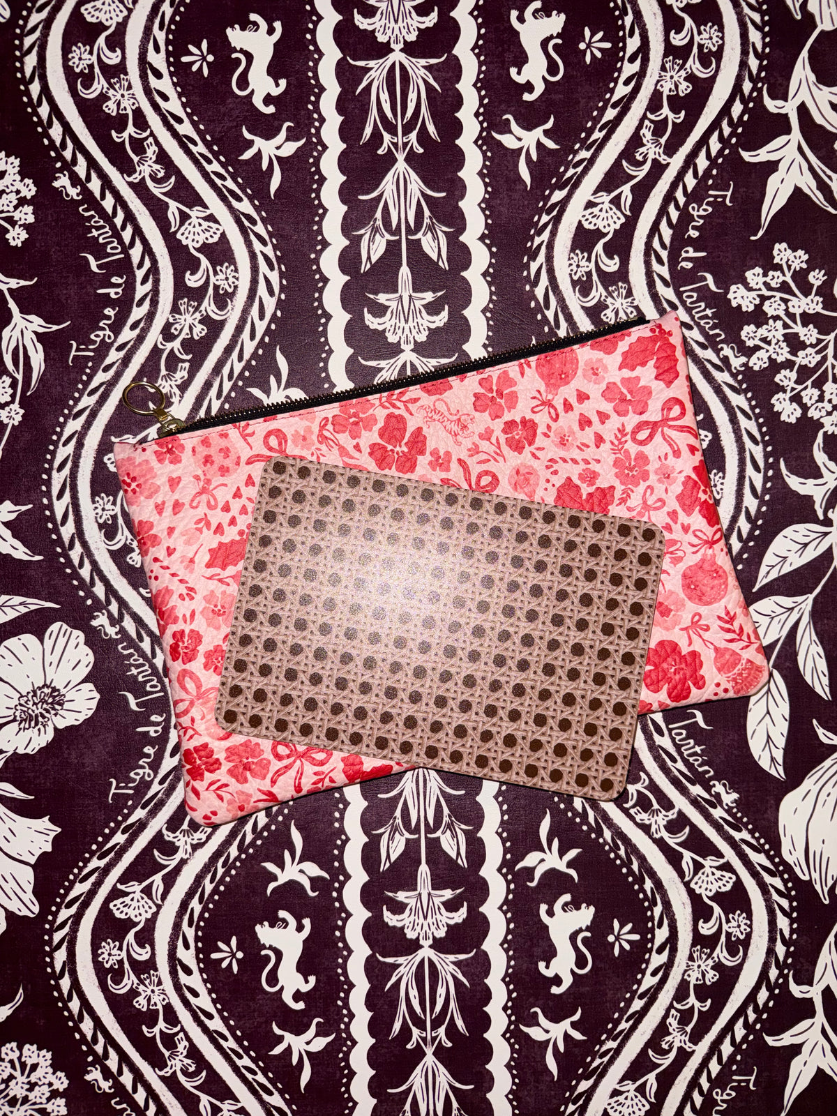 Ditsy Christmas MARASCHINO medium leather pouch with a mahjong card on a dark floral background