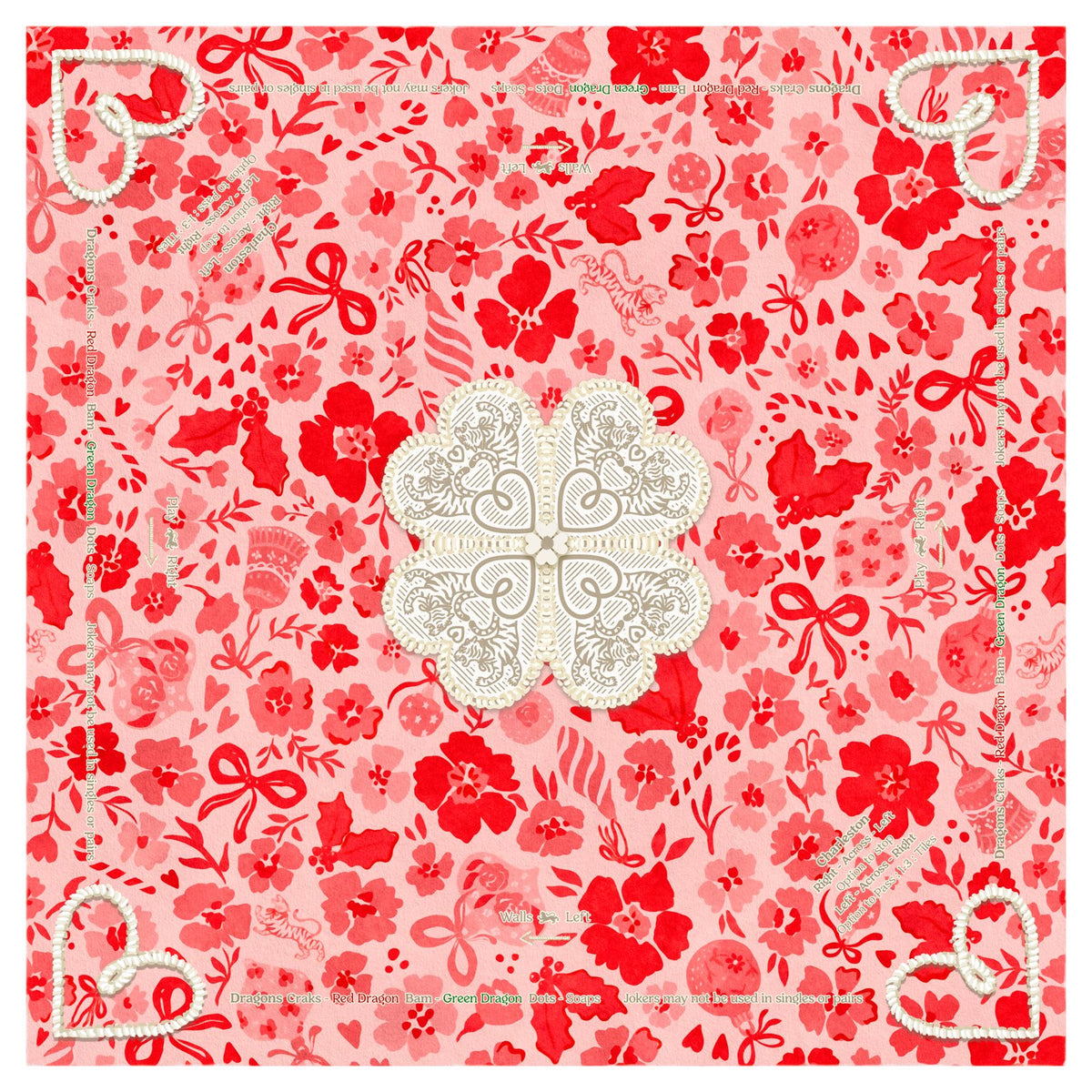 Ditsy Christmas MARASCHINO mahjong mat laid flat: red and pink florals, bows and hearts around a cream lace-heart center medallion