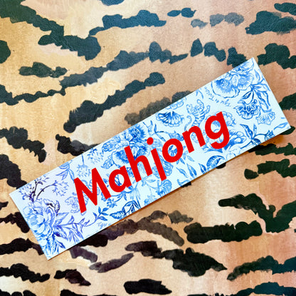 Mahjong bumper sticker, blue-and-white floral with red lettering