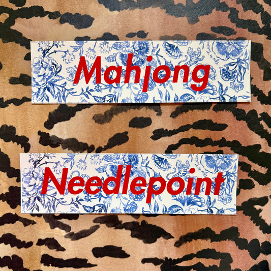 Mahjong and Needlepoint bumper stickers, blue-and-white floral with red lettering, on a tiger stripe background