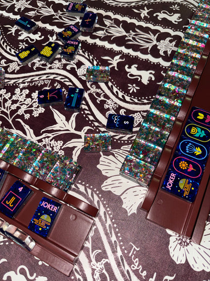 Mahj Pit Confetti mahjong tiles, large size, lined up on a mahjong rack
