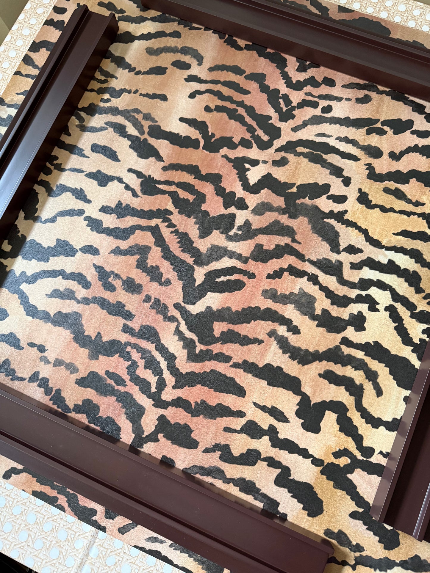 El Tigre new edition mahjong mat with borderless watercolor tiger stripe print, framed by two dark wood mahjong racks