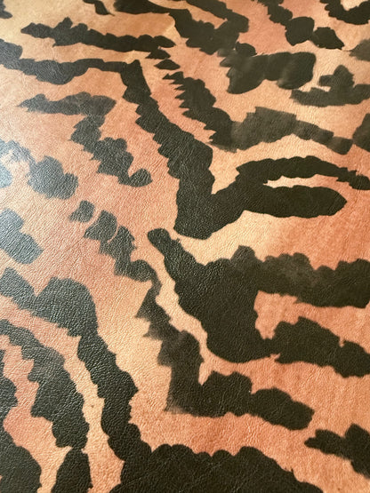 Close-up of the El Tigre watercolor tiger stripe print on PLAYFINISH faux leather