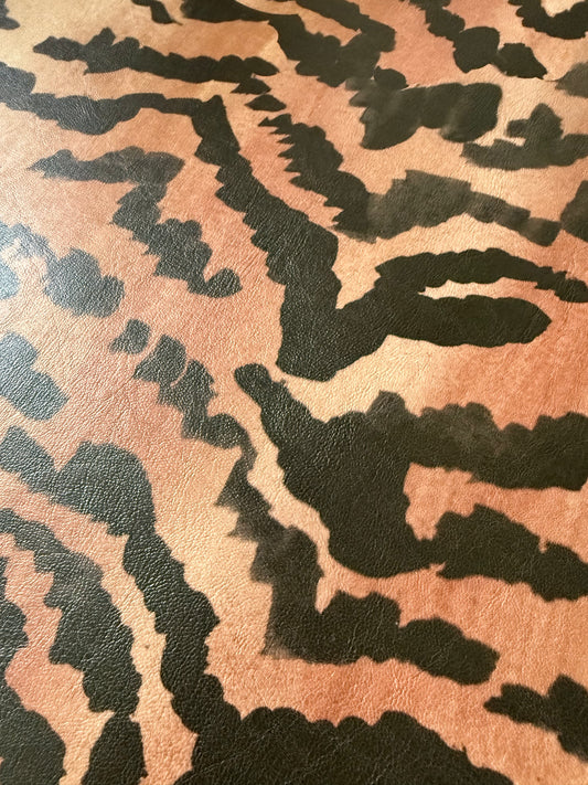 Close-up of the El Tigre watercolor tiger stripe print on PLAYFINISH faux leather