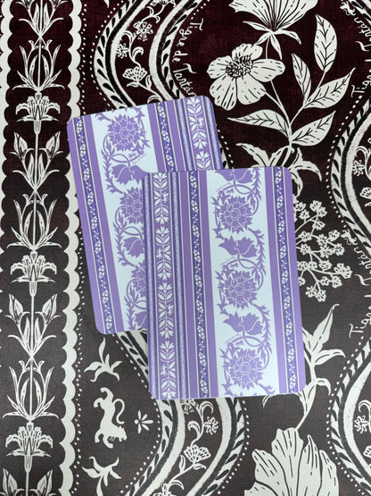 Two lavender and white Thorn-print mahjong tile shufflers with floral vine stripes, on a dark plum and white botanical print