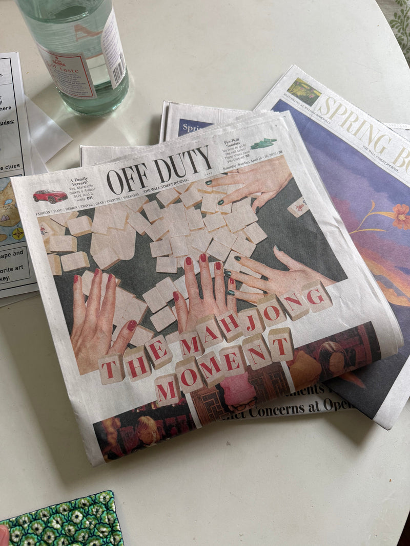 The Wall Street Journal Off Duty section open to "The Mahjong Moment", resting on a Tigre de Tartán mat